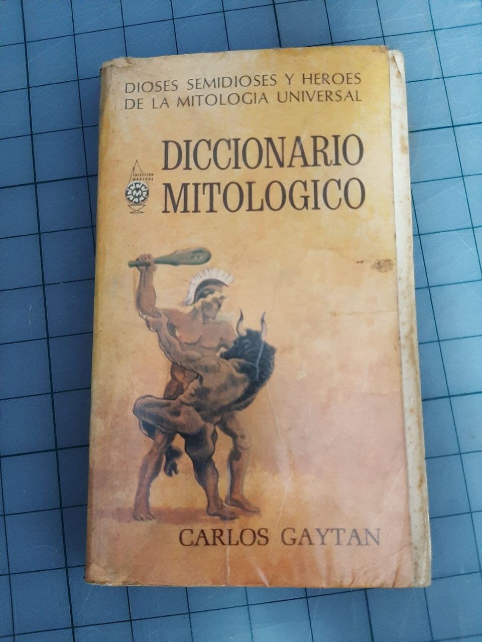 Shrunken plastic wrap has pulled back the front cover.