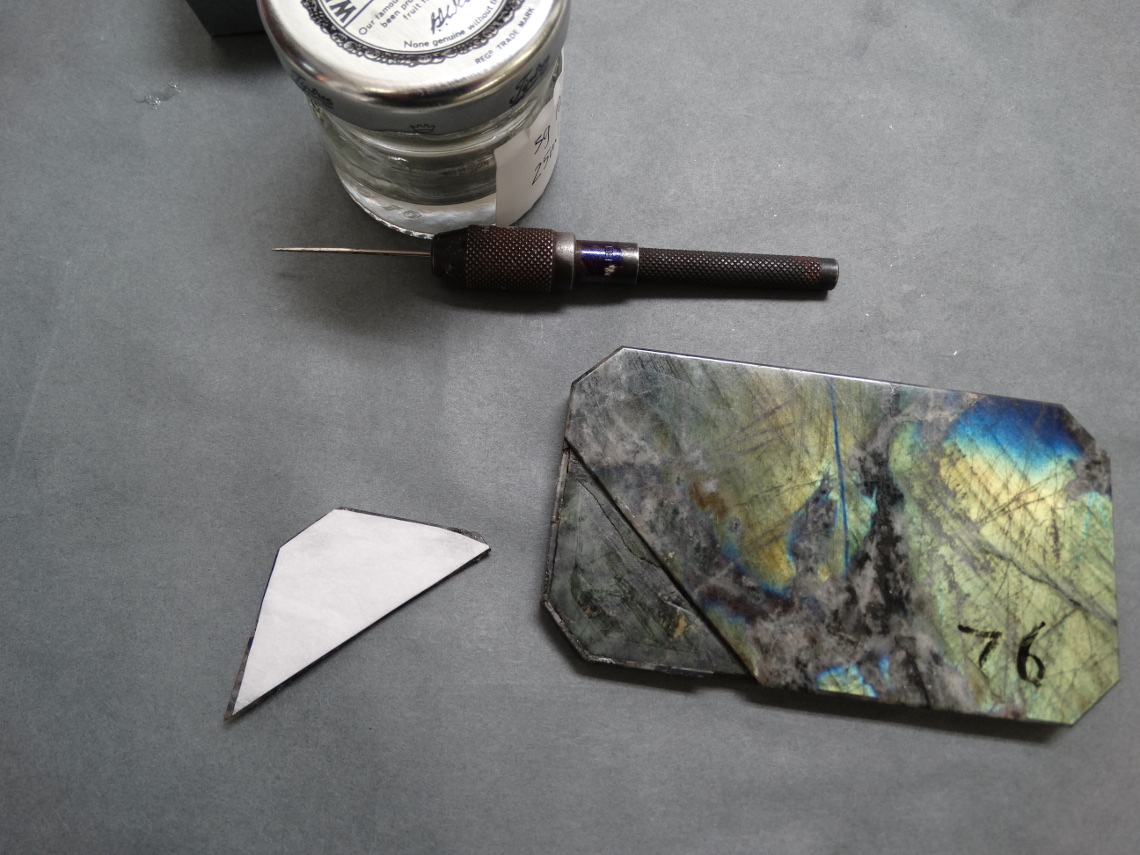 Adhering the top stone layer with tissue paper layer