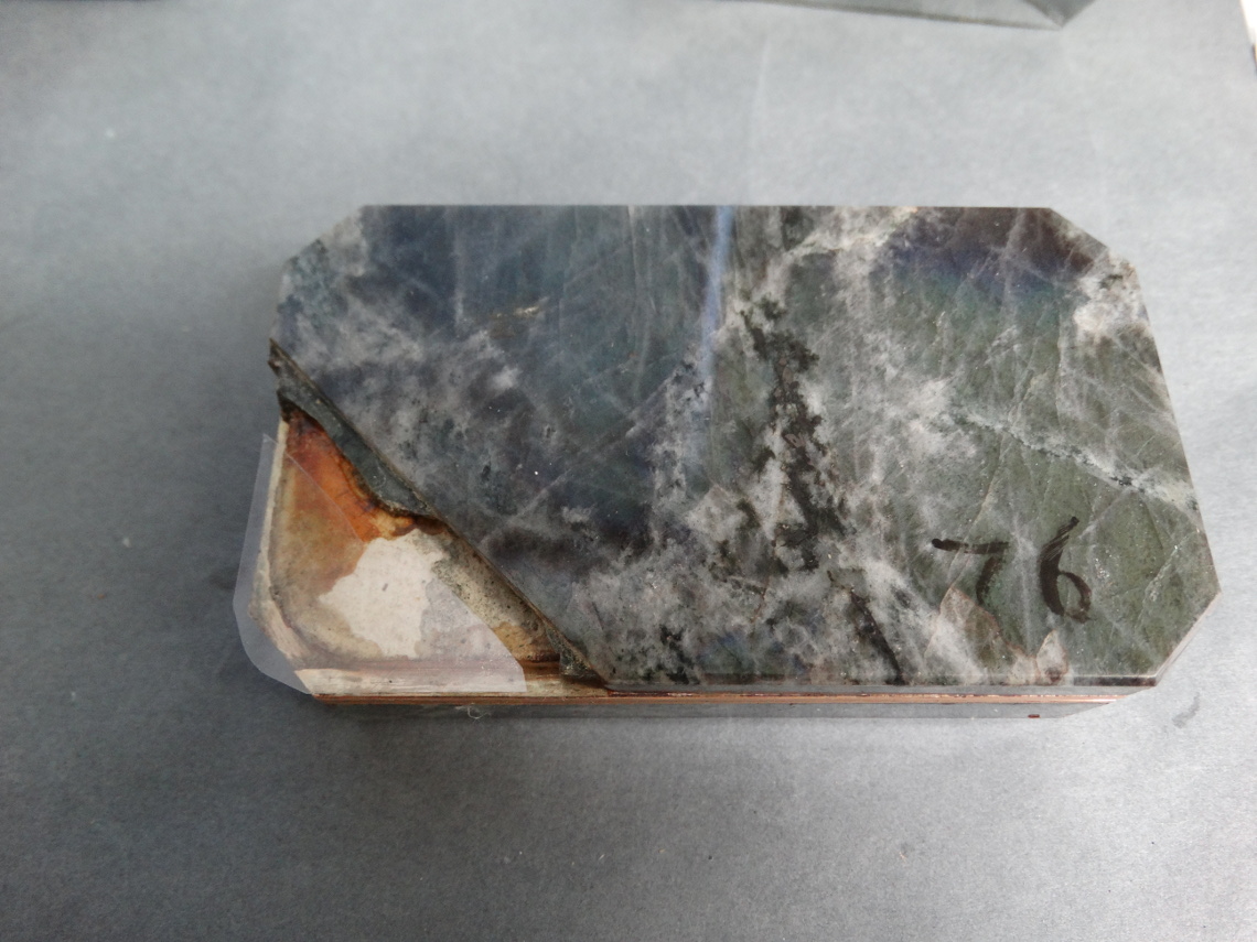 A small piece of Melinex polyester film was inserted to protect the original paper